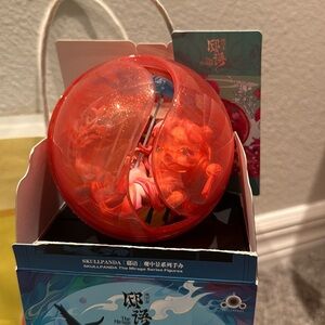 Orange Capsule Toy with Figure